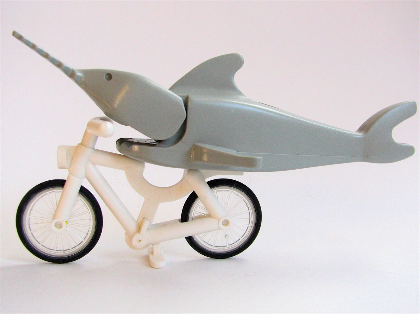 A Lego fish on a Lego bicycle