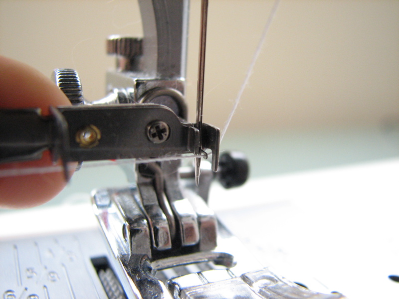 place thread across hooks