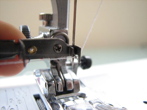 place thread across hooks