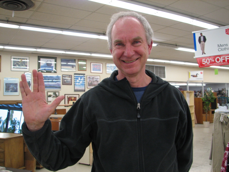 Stranger making the Vulcan greeting hand sign