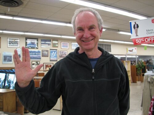 Stranger making the Vulcan greeting hand sign