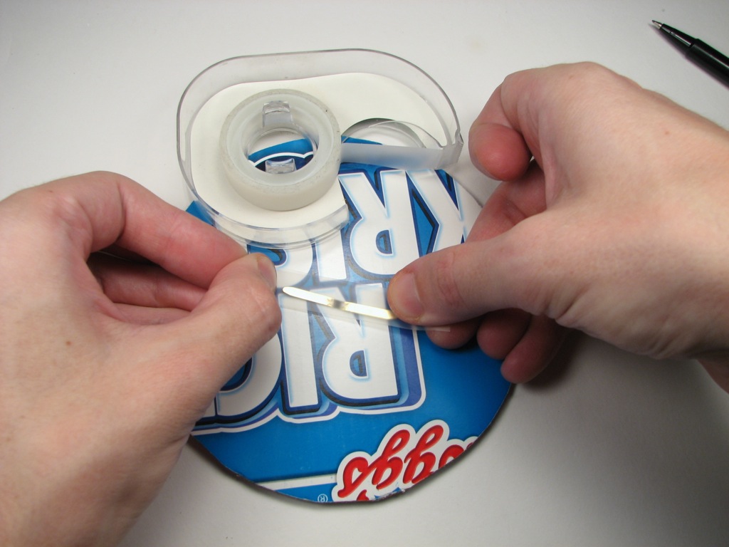 Tape down fastener, back side