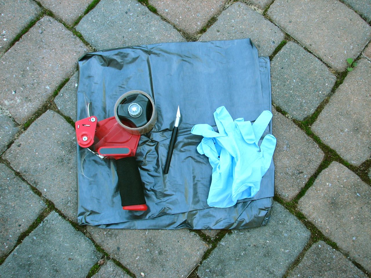 Tape, hobby knife, gloves, plastic bag