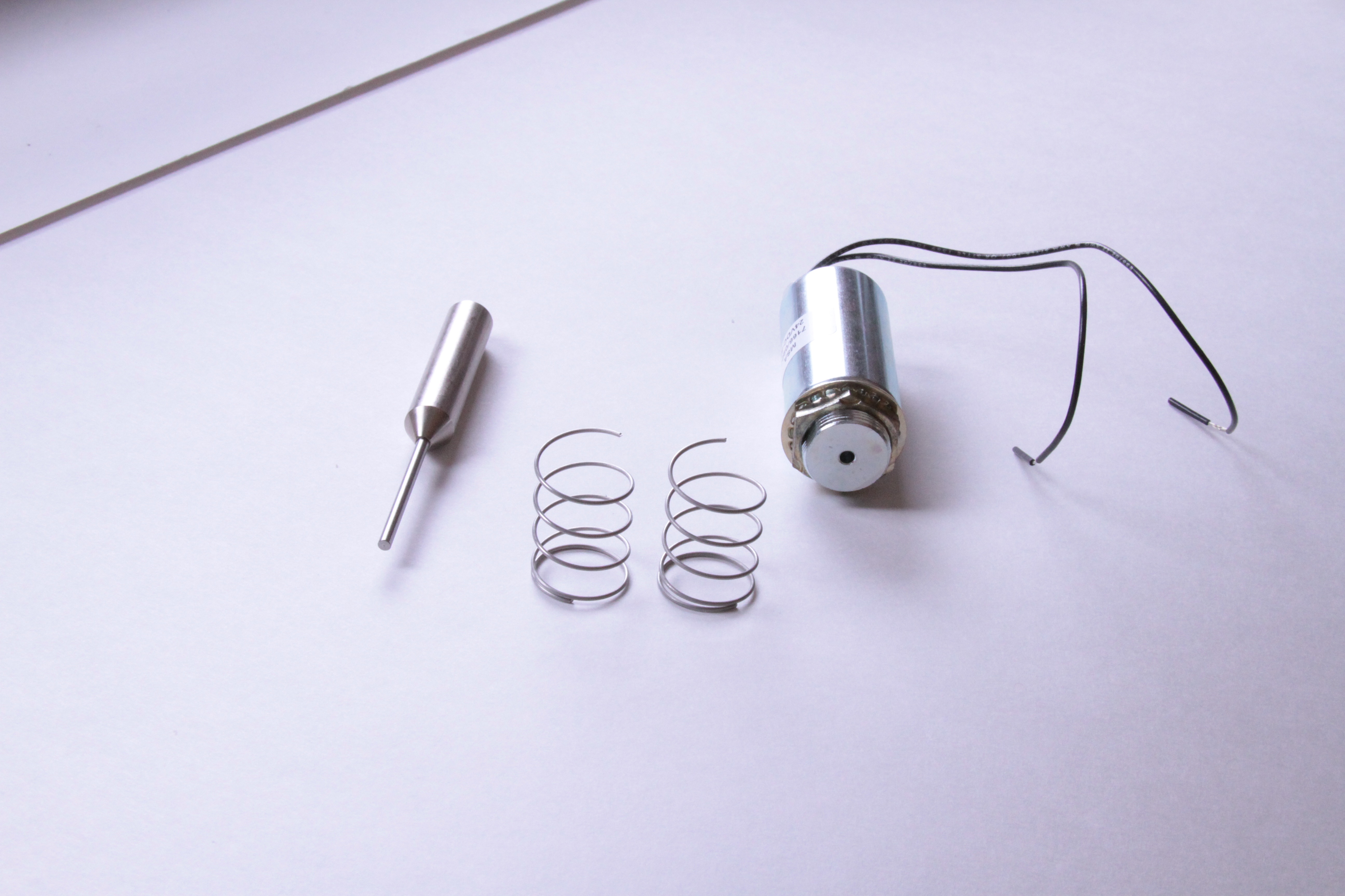 Solenoid with spring