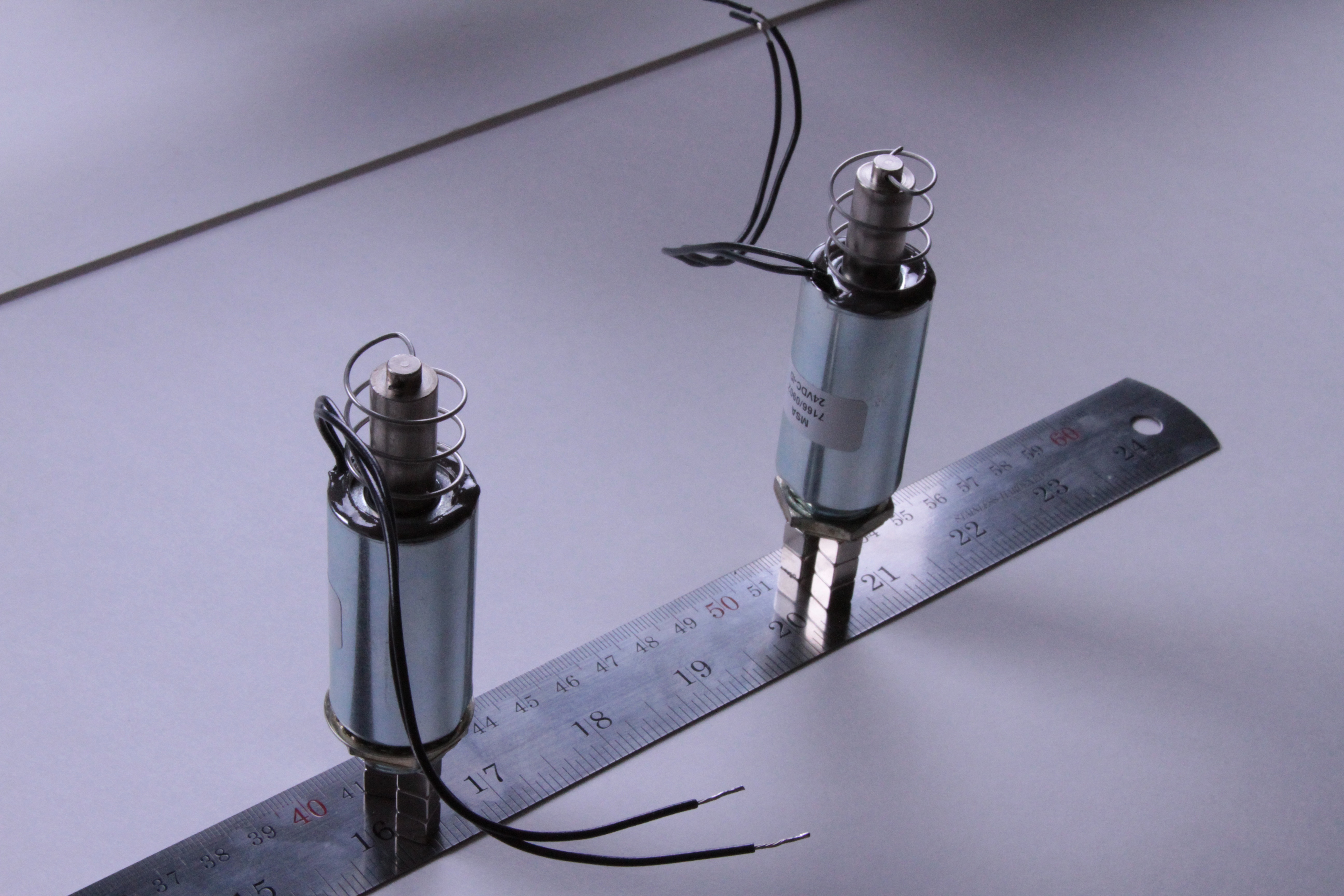 Gluing springs to solenoids