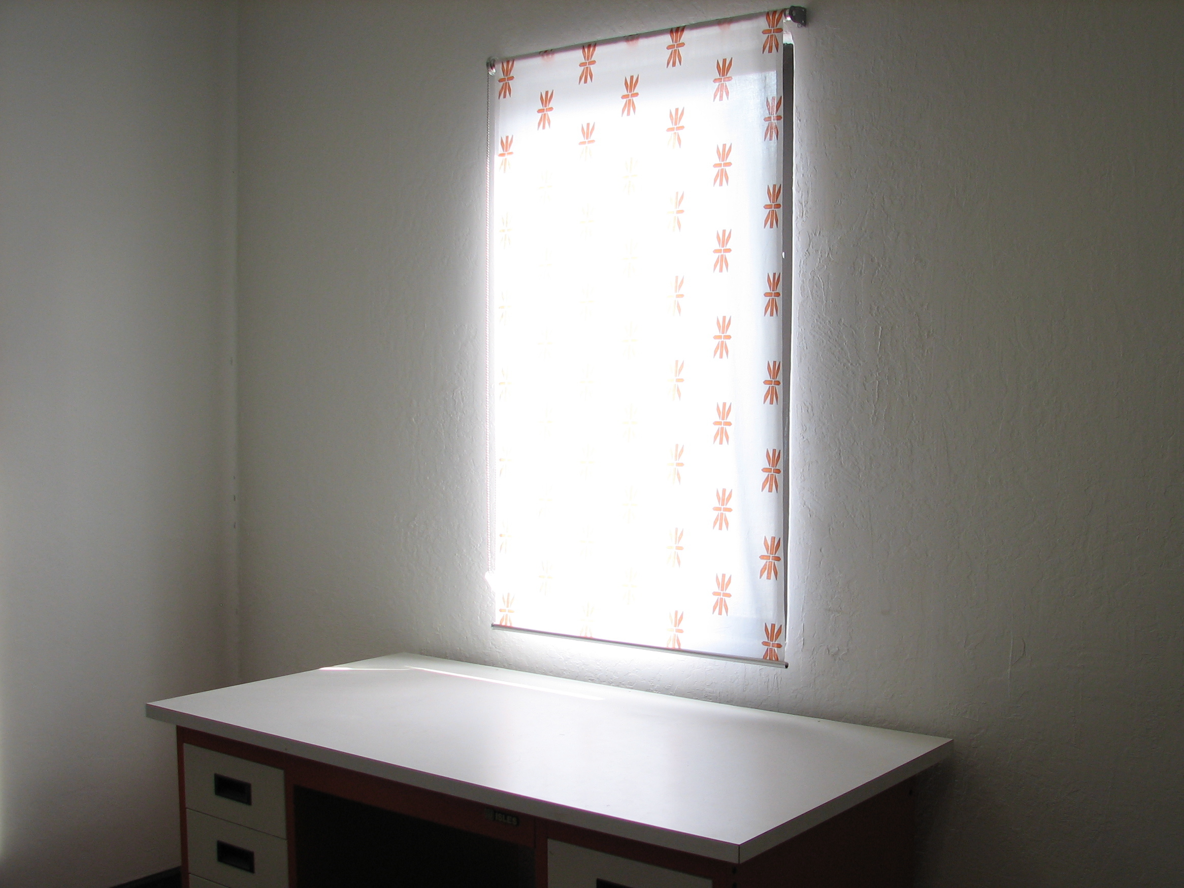 Evil Curtains closed over desk