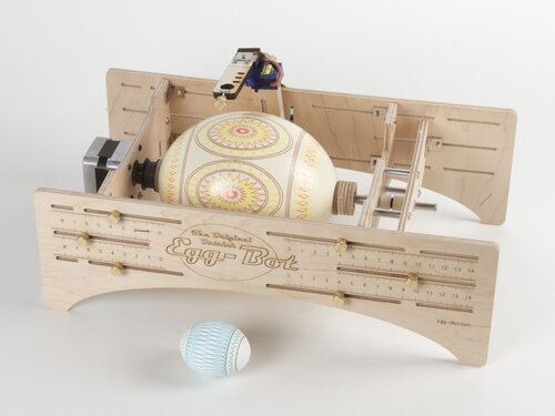 ostrich egg in eggbot with chicken egg for comparison