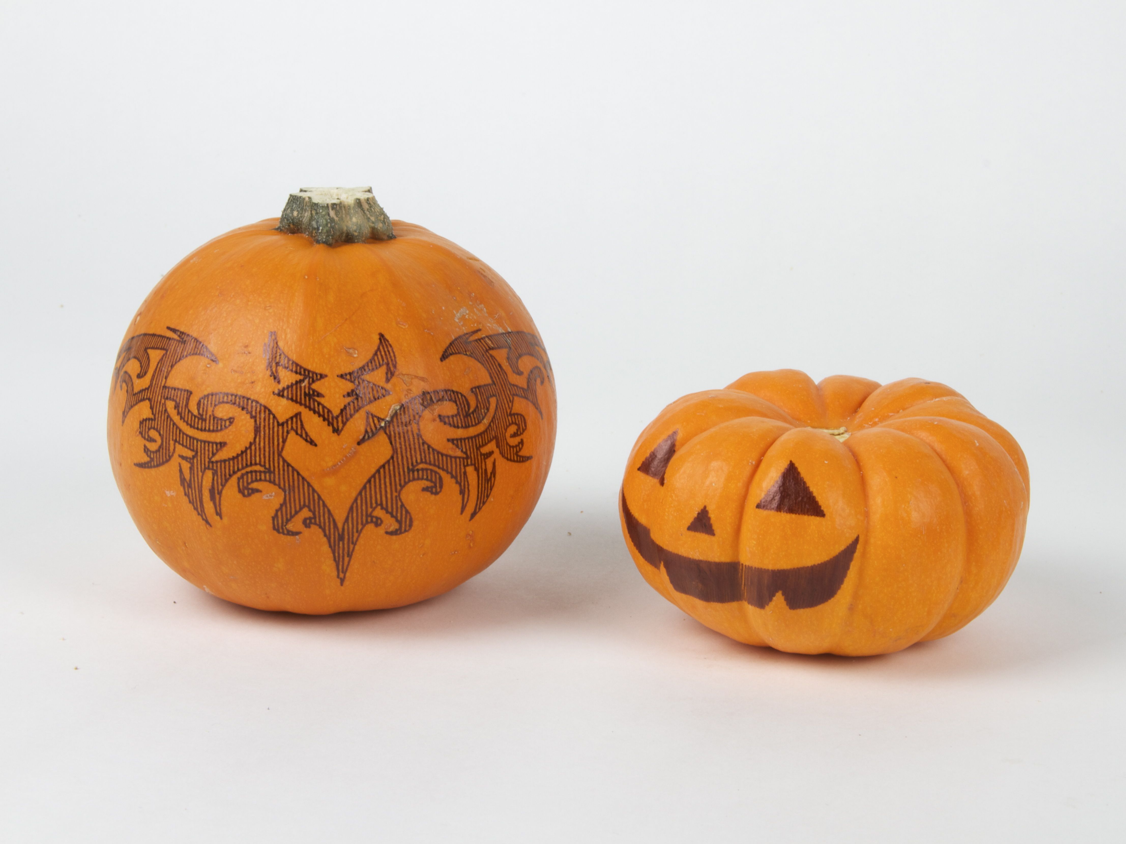 mini jack-o-lantern with bat tattoo pumpkin