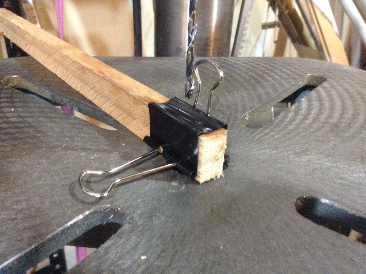 Binder clip on wood piece for drilling