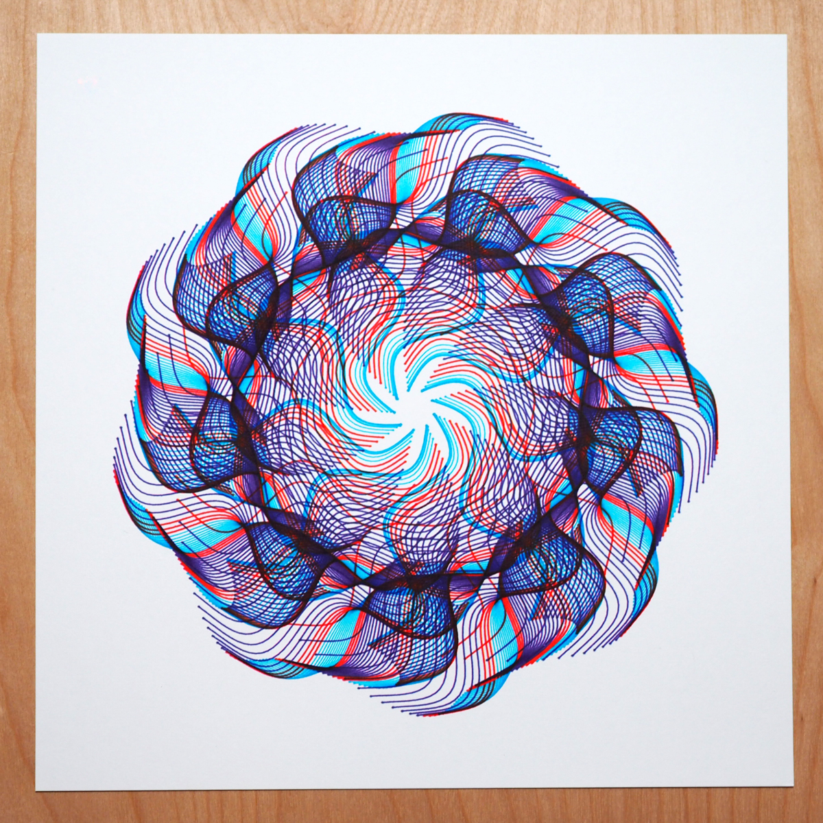 radial design in blues and red on white paper